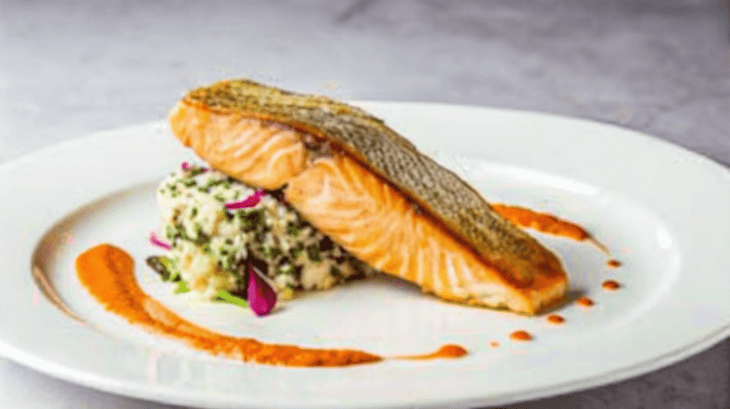 Salmon is safe at 145°F. This temperature fully cooks the fish, ensuring safety and preserving its flavor and texture. Use a thermometer to check for doneness.