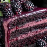 Gothic Blackberry Velvet Cake with dark purple frosting on a Victorian-style table.