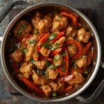 Peppery chicken stir fry with bell peppers and black pepper sauce.