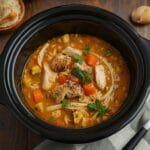 Slow cooker chicken rice soup with tender chicken and vegetables.