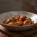 Middle Eastern chicken bowl with spiced chicken, basmati rice, cucumber salad, yogurt sauce, and fresh herbs