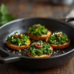 Broccoli rabe crostini topped with ricotta cheese and garlic on toasted bread.