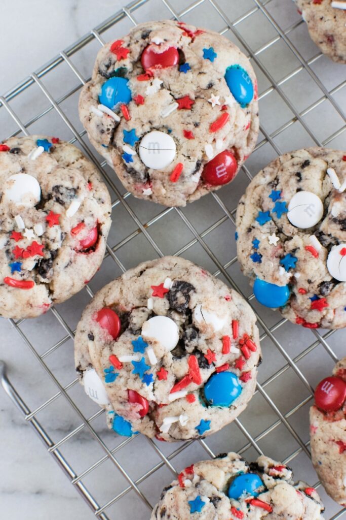 Close-up of 4th of July Cookies showing soft pillowy texture with red white and blue MandMs sprinkles and Oreo pieces inside
