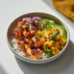 Close-up charred shrimp avocado mango salsa bowl