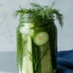 Close-up dill pickle spear crunchy fresh garlic jar