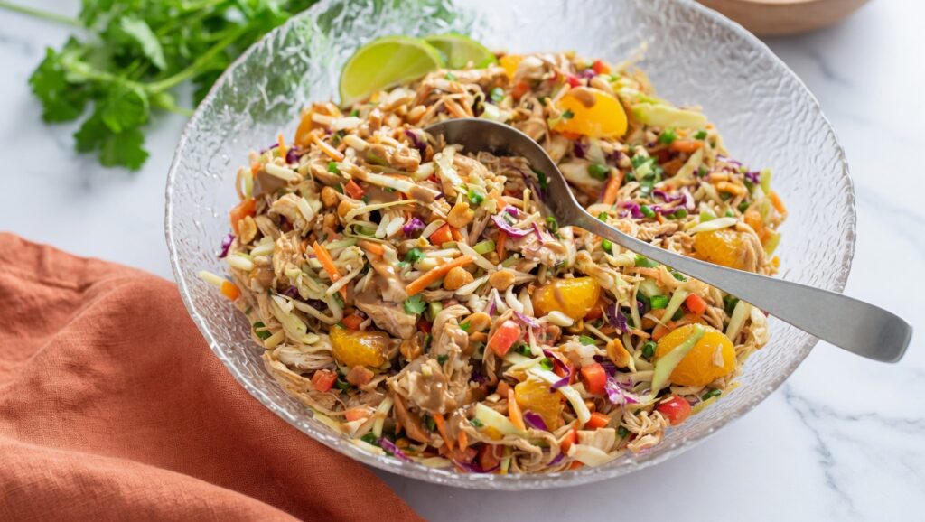 Thai chicken salad glass bowl peanut dressing lime