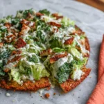Close-up chicken crust pizza Caesar topping Parmesan