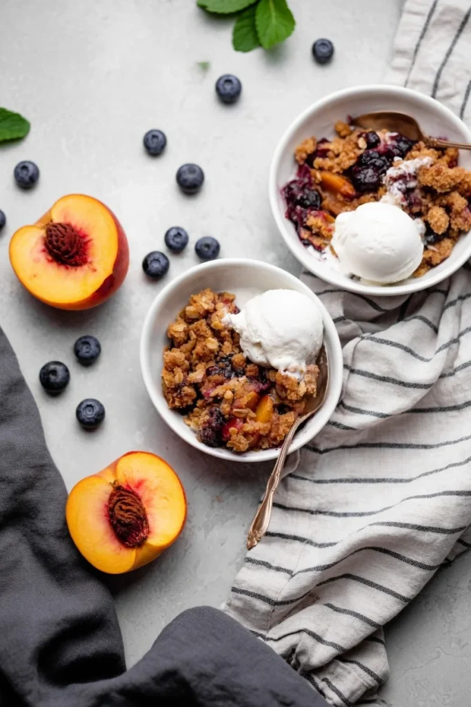 Blueberry peach crumble bubbling oat topping closeup