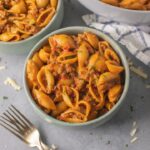 Taco pasta cheesy shell pasta ground beef closeup