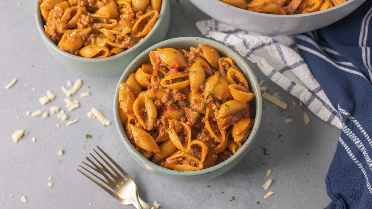 Taco pasta cheesy shell pasta ground beef closeup